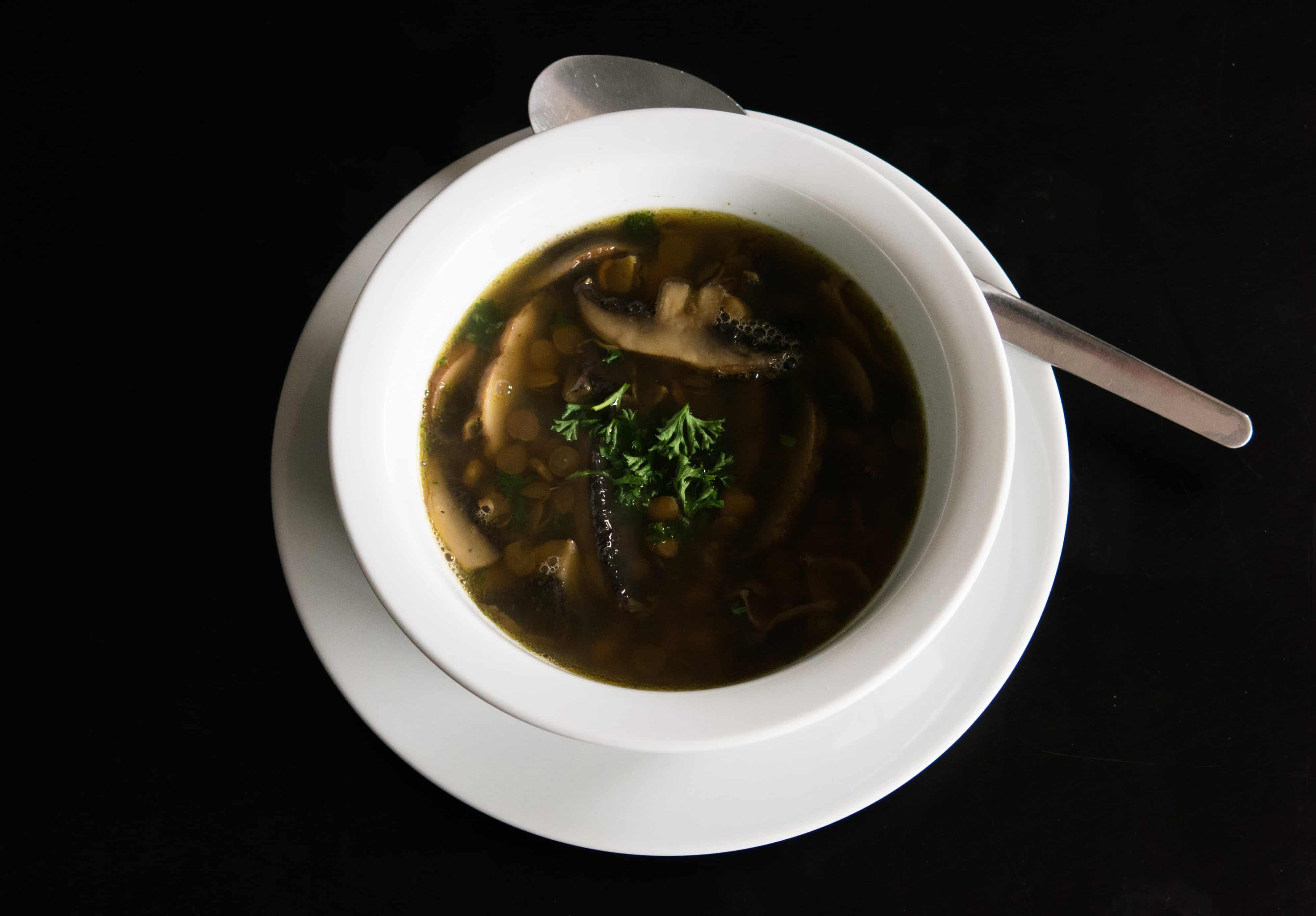 Lentil and Mushroom Soup with parsley. Gluten free, vegan and delicious.