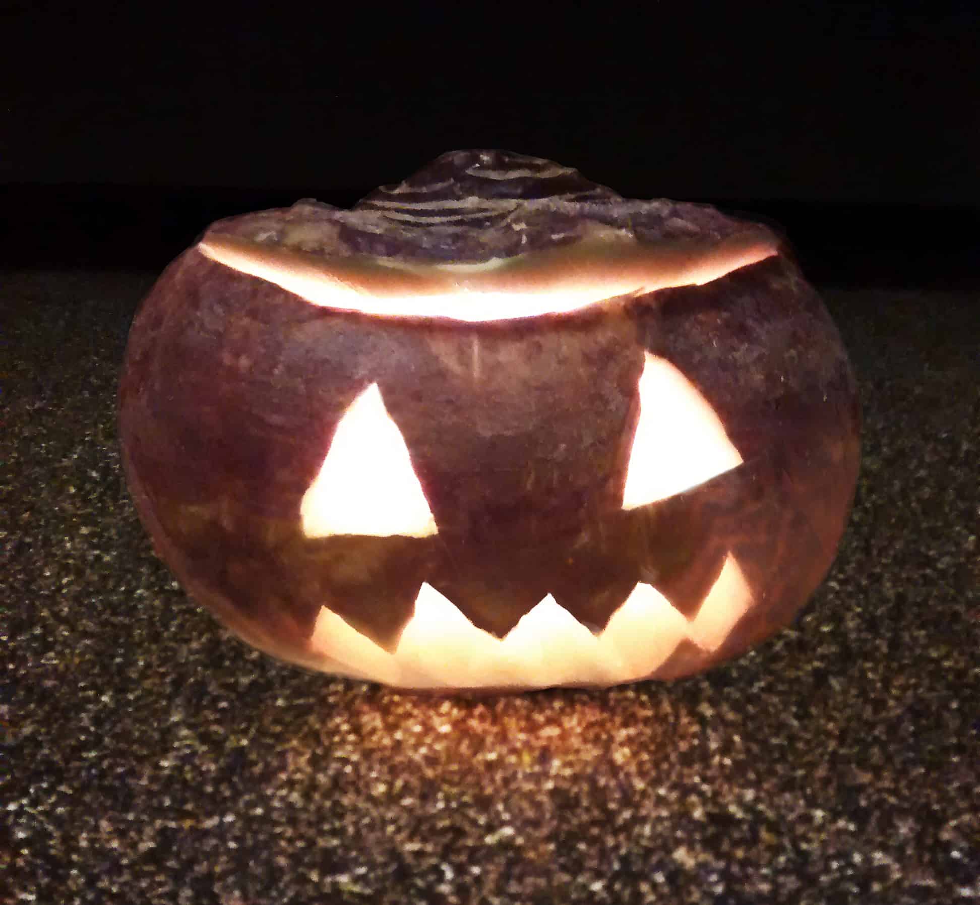 Halloween carved turnip lantern.