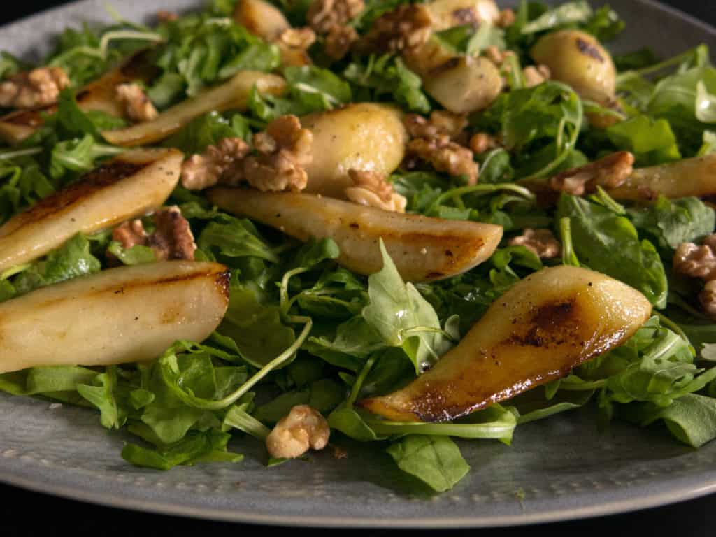 Gluten free, vegan pear and walnut salad. Walnut oil vinaigrette.