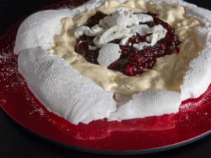Vegan meringue. Gluten free, vegan Pavlova with vegan cream and fresh berries