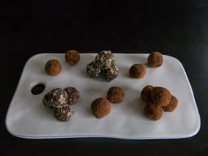 Gluten free, vegan chocolate orange truffles. Nut coated gluten free, vegan chocolate orange truffles