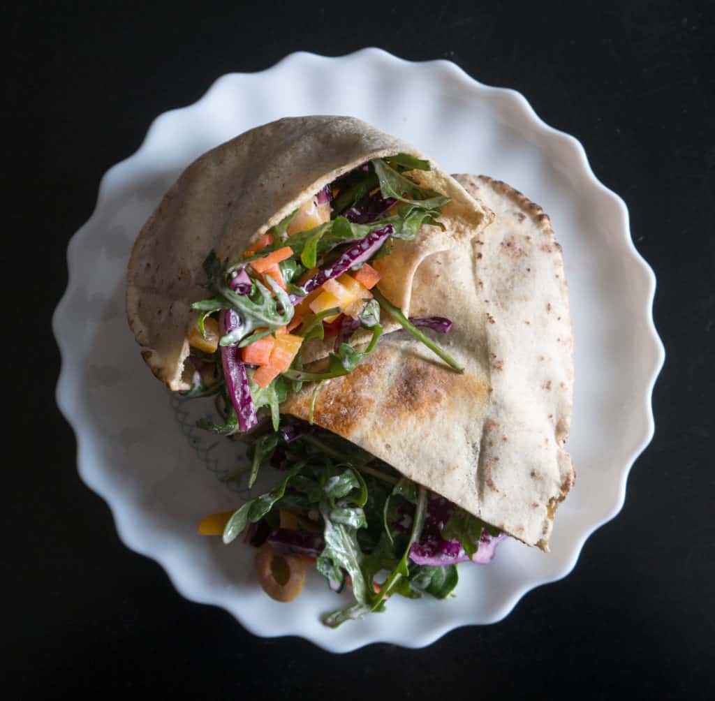 BFee pita stuffed with rocket, carrot, red cabbage, olives and almonds