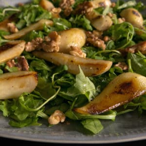 Gluten free, vegan warm pear and walnut salad. Walnut oil vinaigrette.