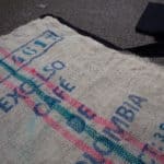 Making a rug from an old coffee bean sack