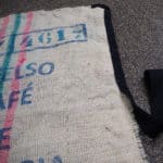 Making a rug from an old coffee bean sack